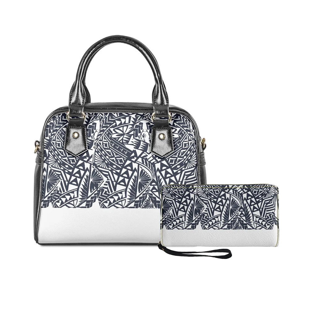 2-piece black and white leather handbag set featuring Polynesian tribal monster leaf print and matching wristlet wallet.