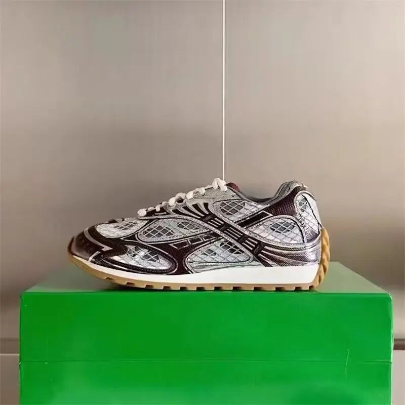 Luxury silver and brown metallic leather sneakers with mesh detailing, white midsole, and gum rubber outsole.