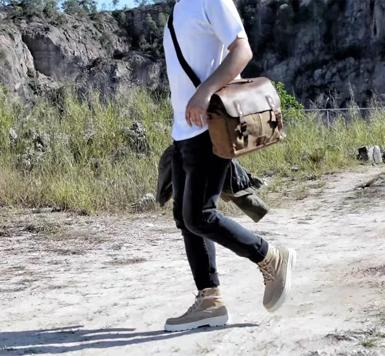 Retro waterproof oil wax canvas and crazy horse leather motorcycle messenger bag in brown.