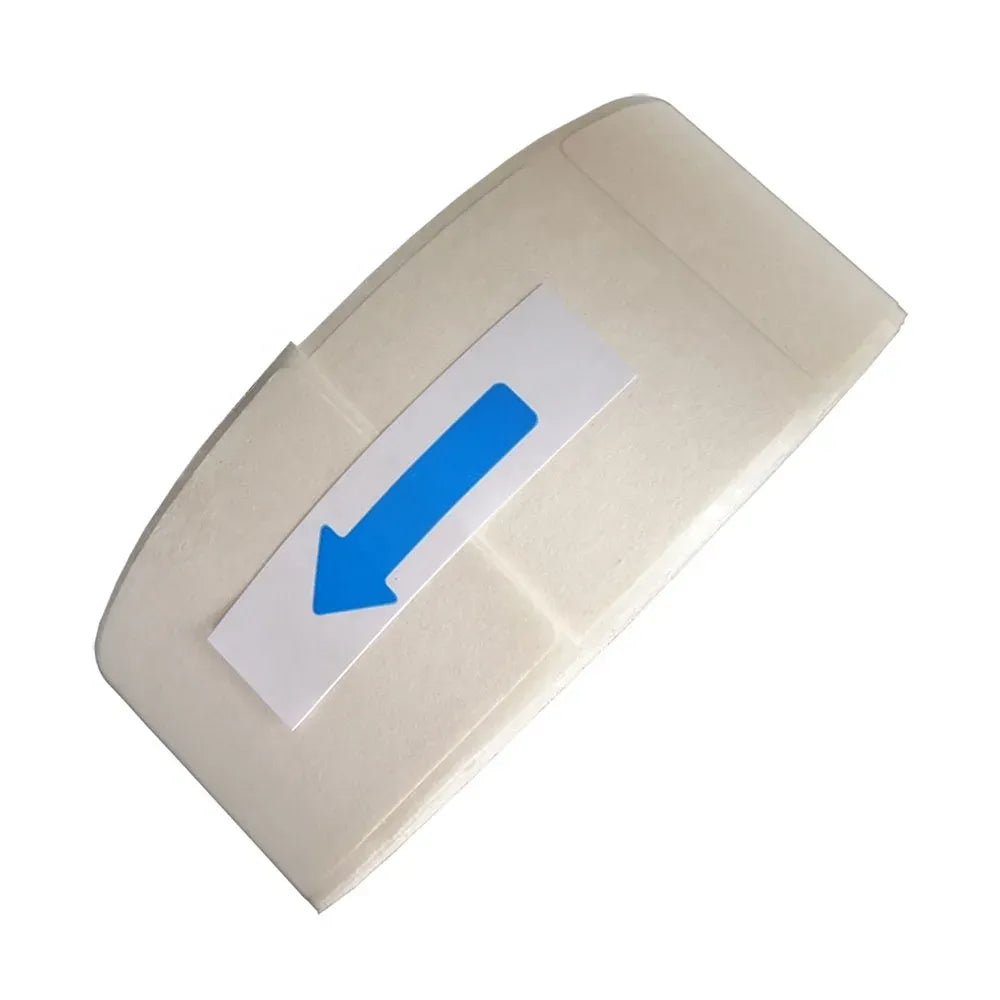 White label roll with arrow marker on label backing paper