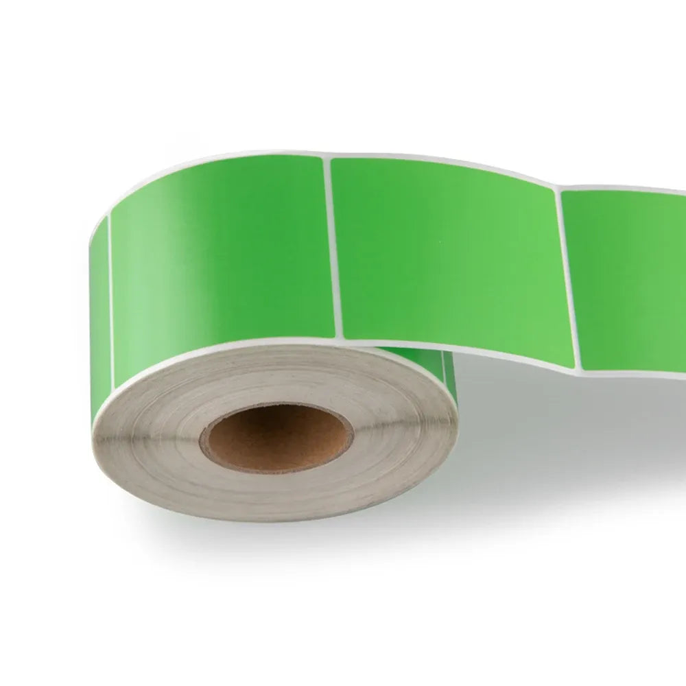 Waterproof label stickers roll with green rectangular printed sections, wide tape roll