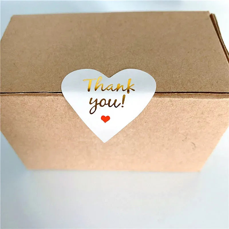 White heart thank you adhesive seal sticker on kraft brown box