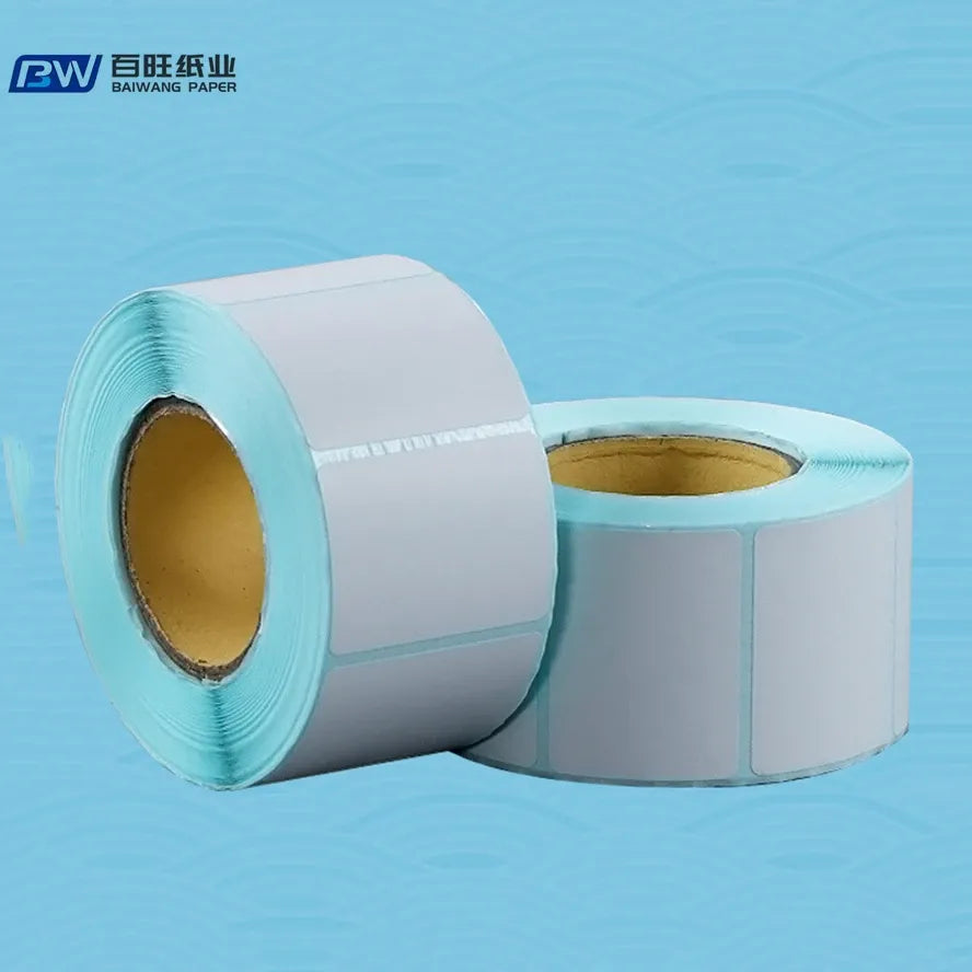 Thermal label roll with light blue outer edge and exposed cardboard core