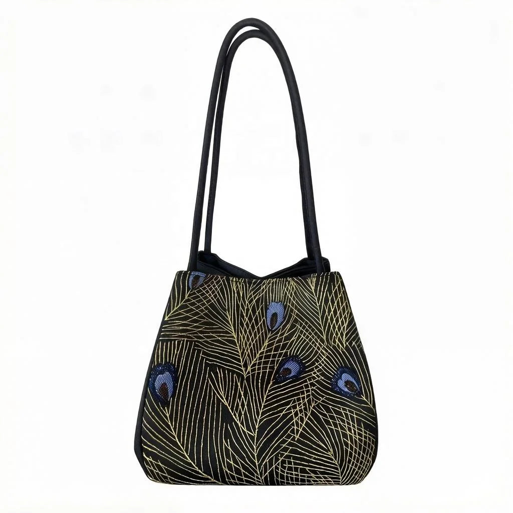 Black Suzhou embroidery crossbody purse with gold peacock feather stitching and blue accents, lightweight trunk style.