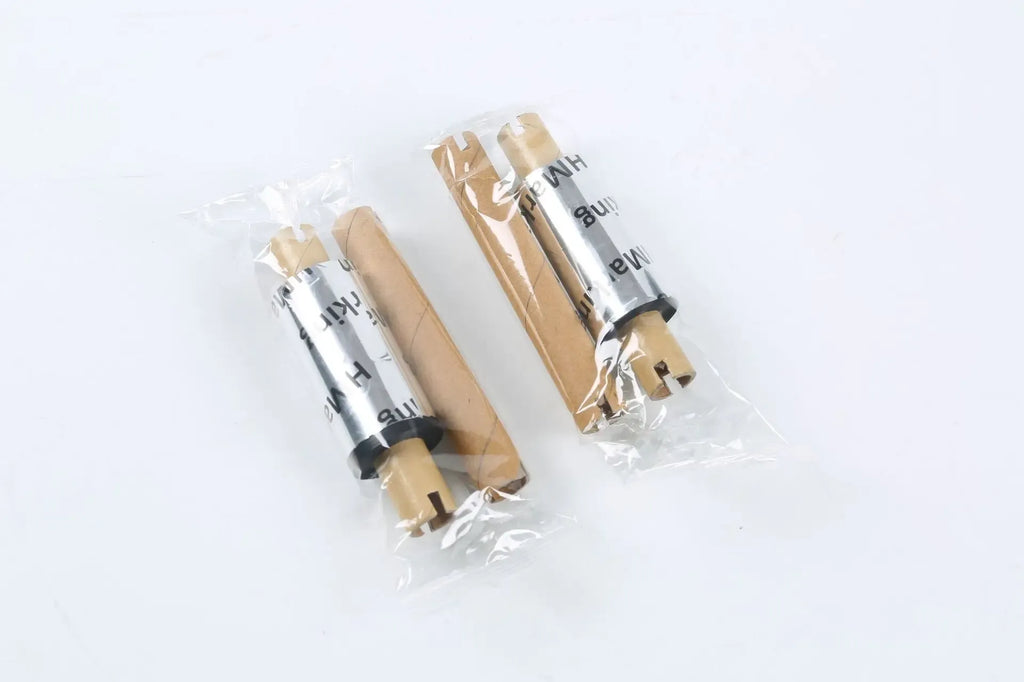 Clear packaging tape rolls wrapped in plastic with cardboard cores