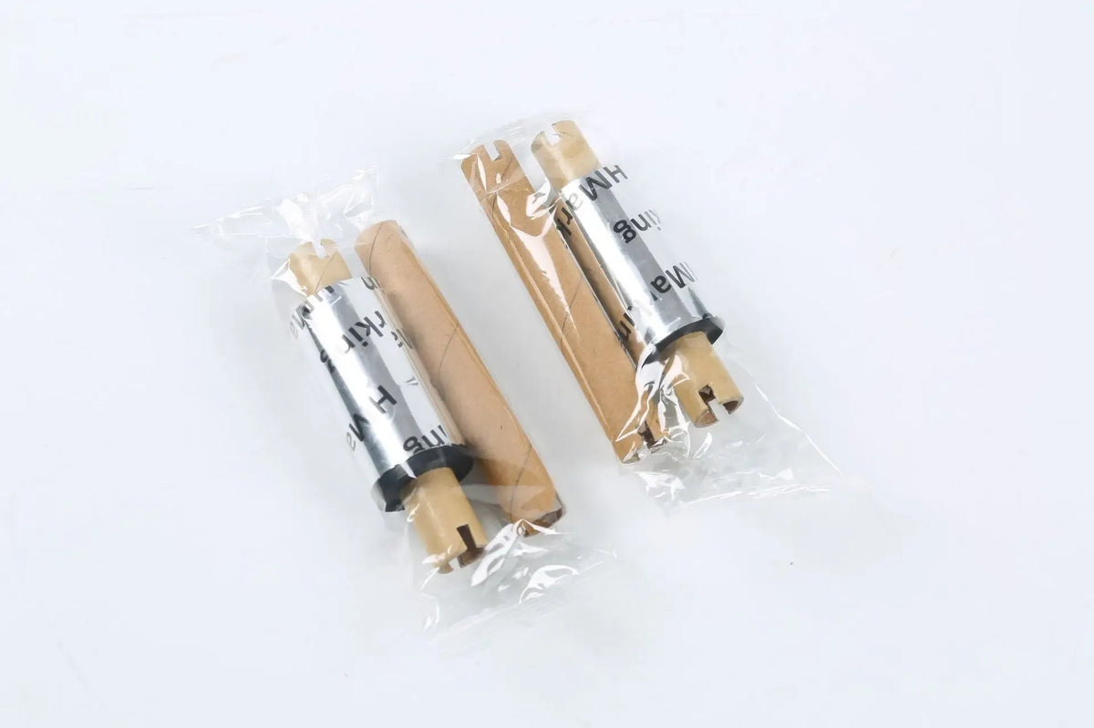 Clear packaging tape rolls wrapped in plastic with cardboard cores