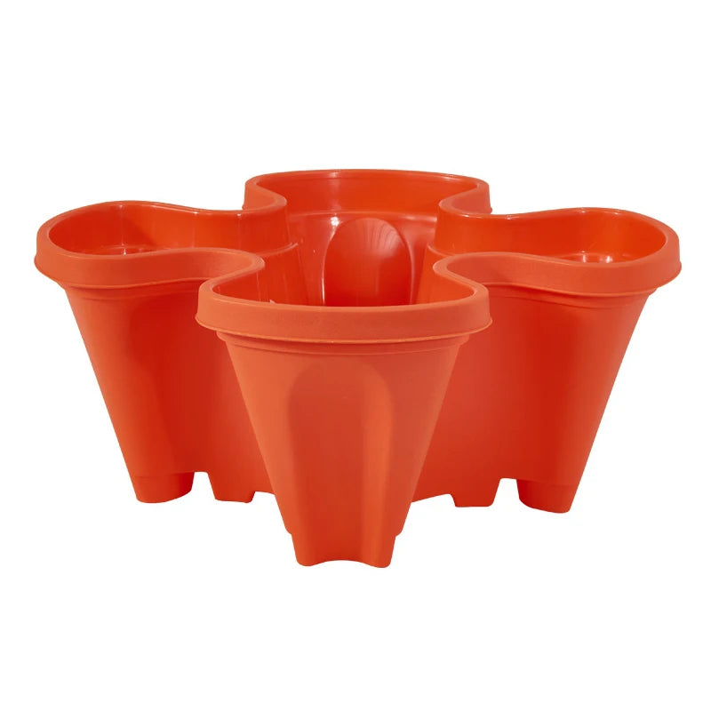 Stackable plastic flower pot set in orange-red, three connected vertical planters.