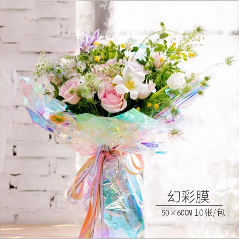 Iridescent holographic bouquet wrap with pastel rainbow sheen and multicolor ribbon bow