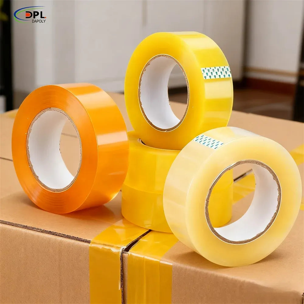 Yellow and orange packing tape rolls on sealed cardboard boxes