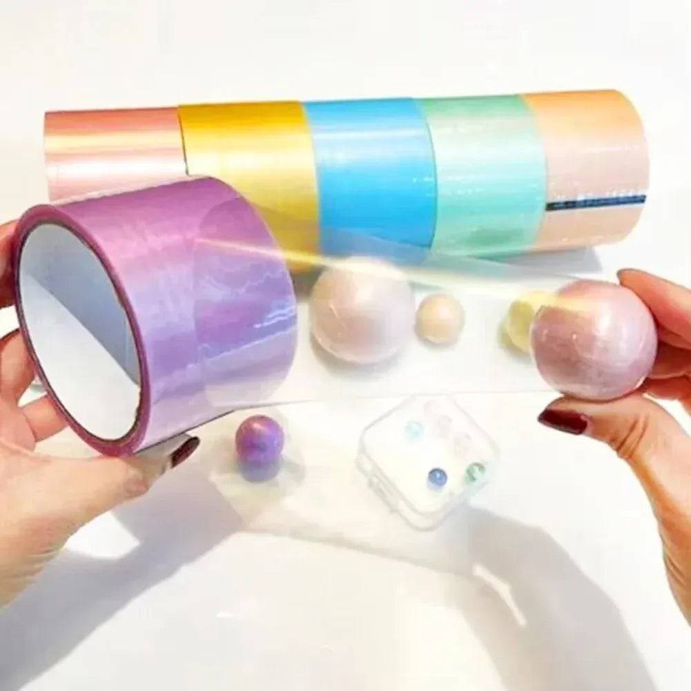 Hand holding multicolor glow tape rolls in blue, orange, yellow, and purple