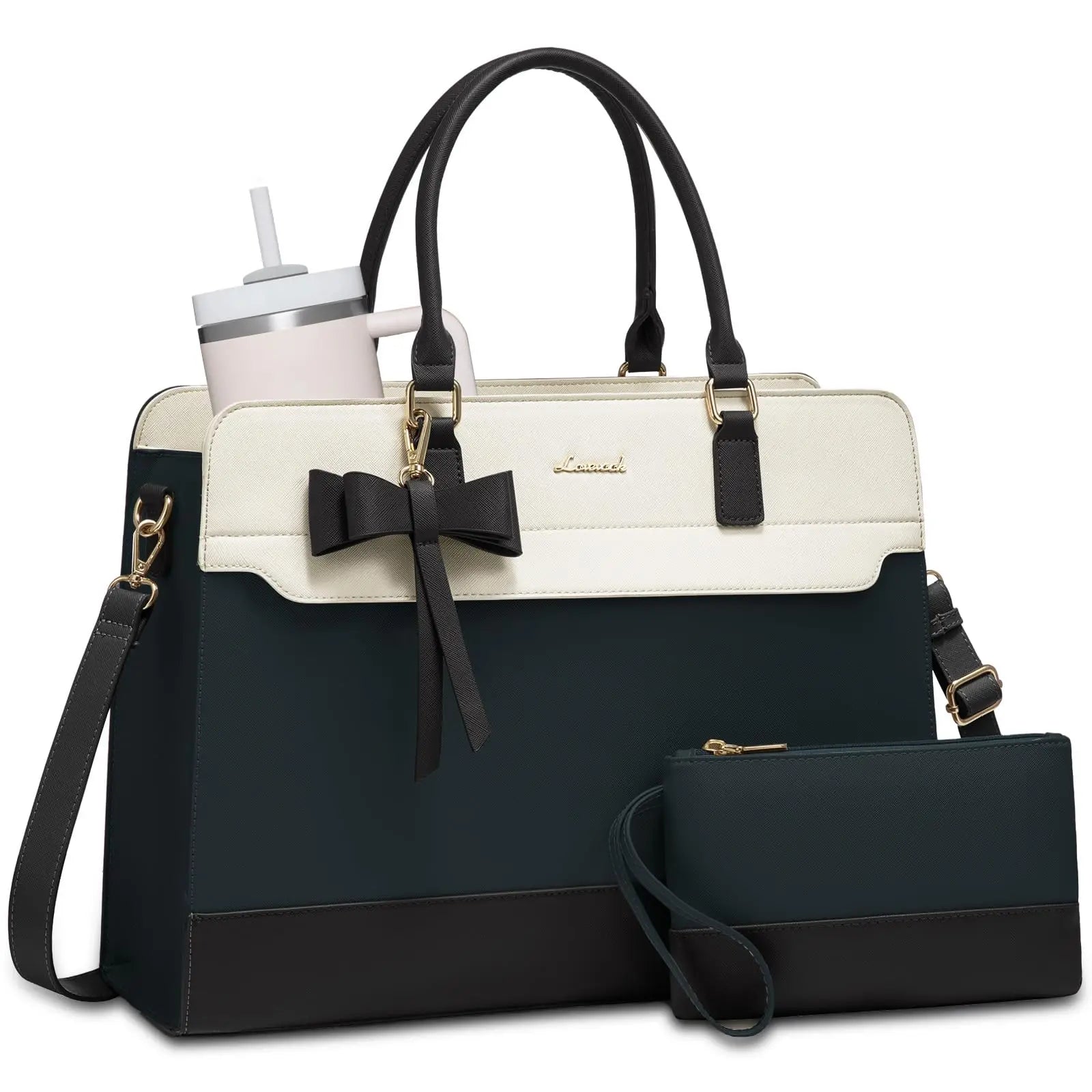Two-tone black and cream designer laptop tote with bow charm, shoulder strap, and matching wristlet clutch.