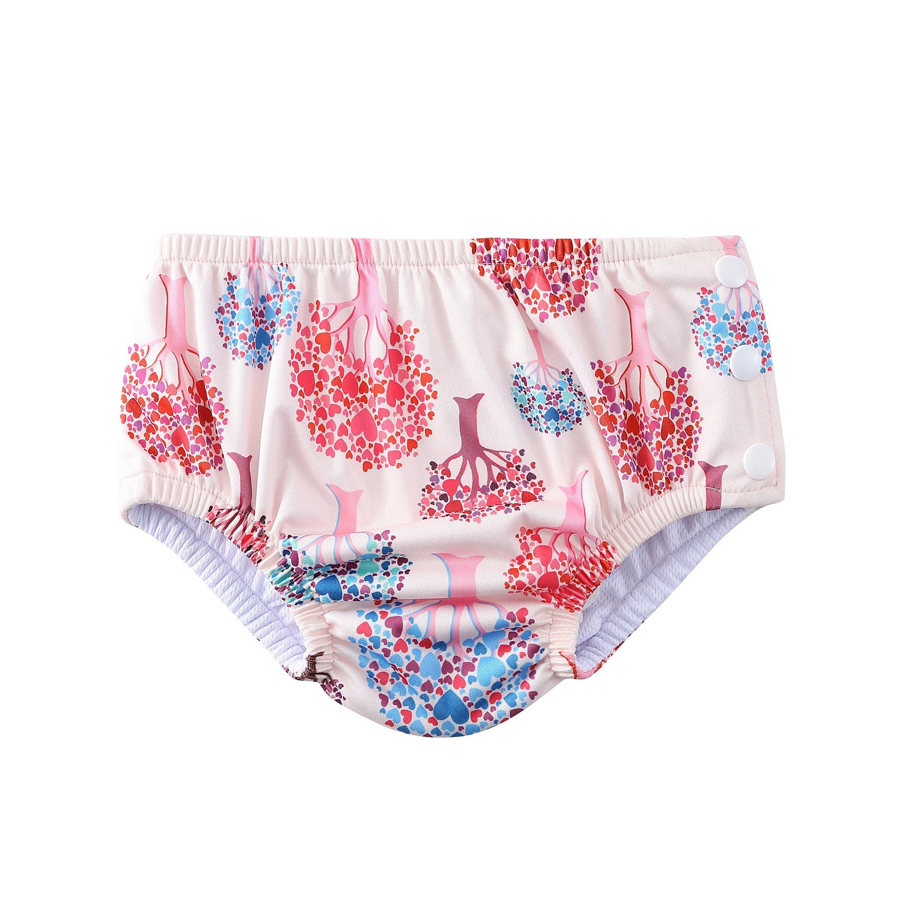 Reusable baby swim diaper in pink with colorful heart tree pattern and side snap closures.