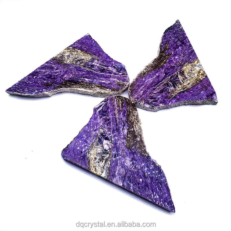 Set of three polished purple charoite slice stones, triangular irregular pieces