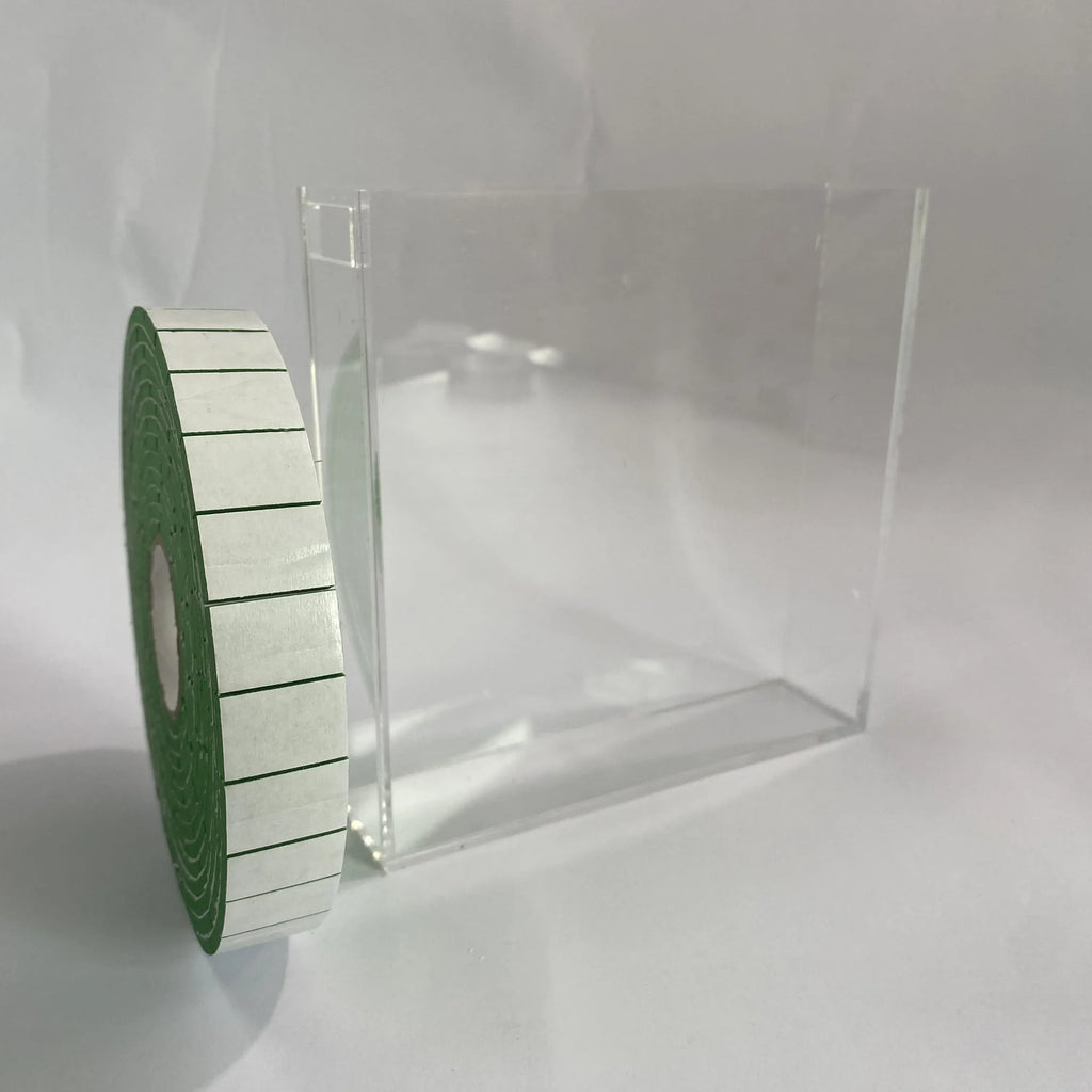 Green EVA foam tape roll on clear stand, self-adhesive rectangular strips