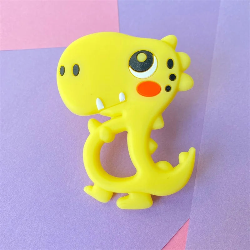 Yellow silicone dinosaur baby teething toy for soothing sore gums.