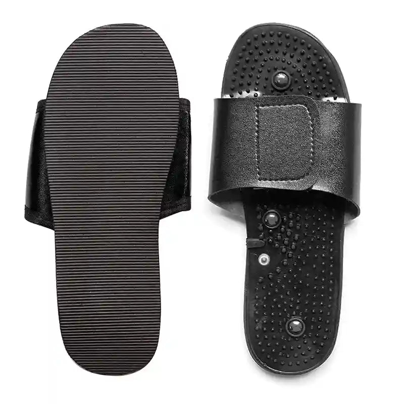 Black acupoint reflexology massage sandals with textured footbed and adjustable velcro strap for foot relaxation.