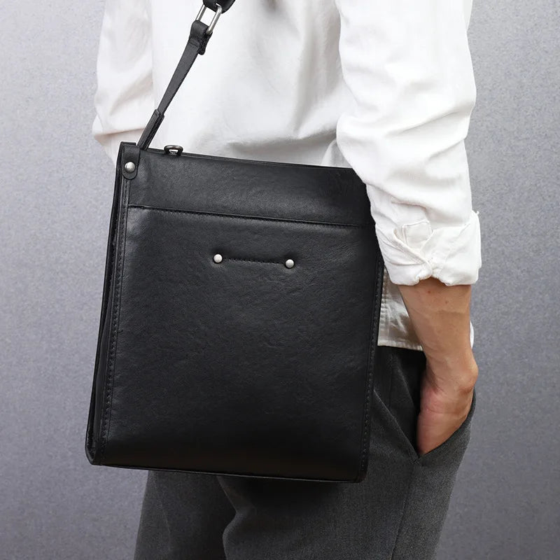 Black genuine leather waterproof crossbody tote bag, ultra-lightweight business casual shoulder bag with metal studs.