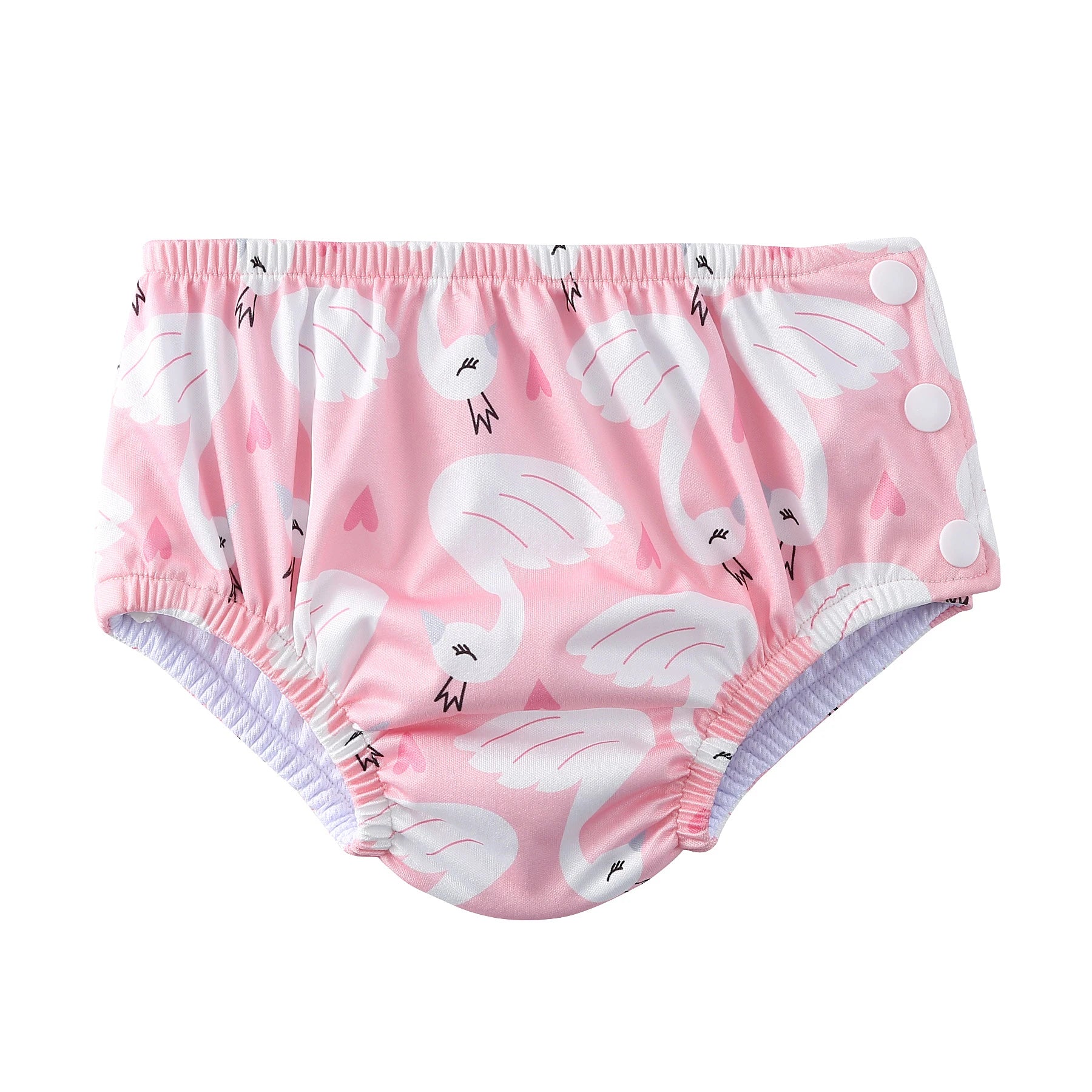 Reusable baby swim diaper in pink with white swan pattern and side snap closures.
