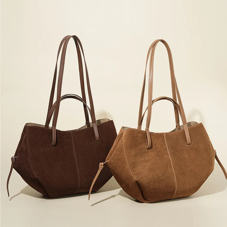 Designer luxury suede leather shoulder tote bags in dark and light brown with structured panels and long handles.