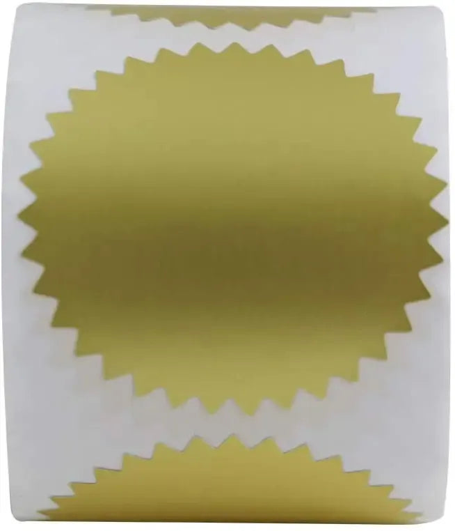 Gold foil round labels on white roll, close-up of jagged border