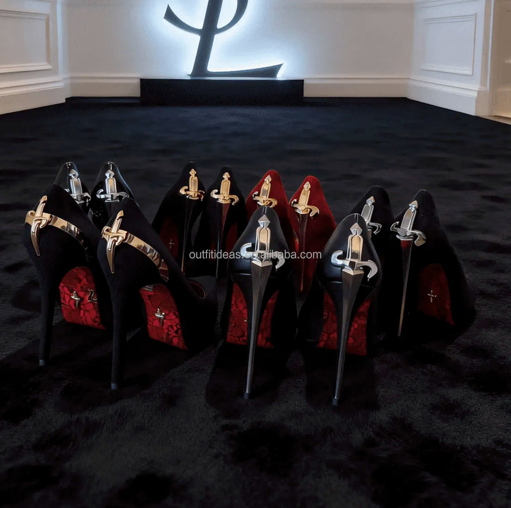 Luxury black and red stiletto heels with gold and silver sword-inspired metallic heel accents for evening wear.