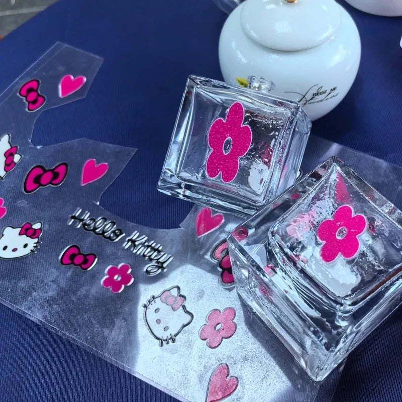 Waterproof die-cut vinyl character and heart stickers in pink and red on a sheet