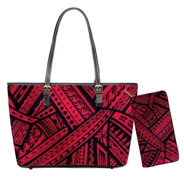 Red and black Polynesian tribal print leather handbag and matching wallet set with shoulder straps.
