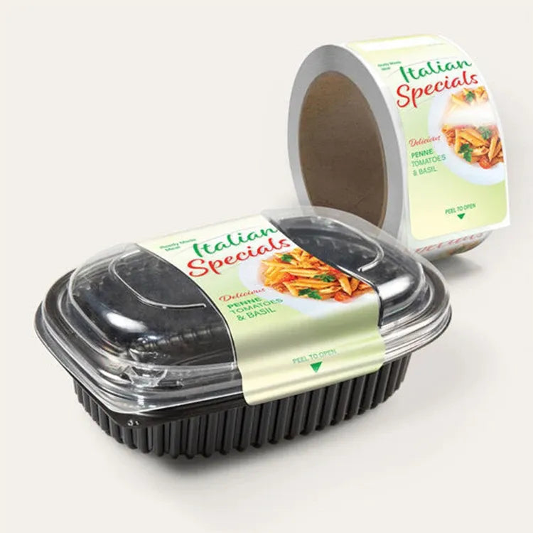 Printed sticker label roll with Italian specialities design, shown with a meal container