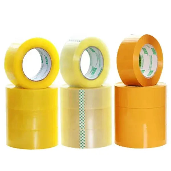 Three packing tape rolls in yellow and orange with visible inner cores