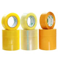 Three packing tape rolls in yellow and orange with visible inner cores
