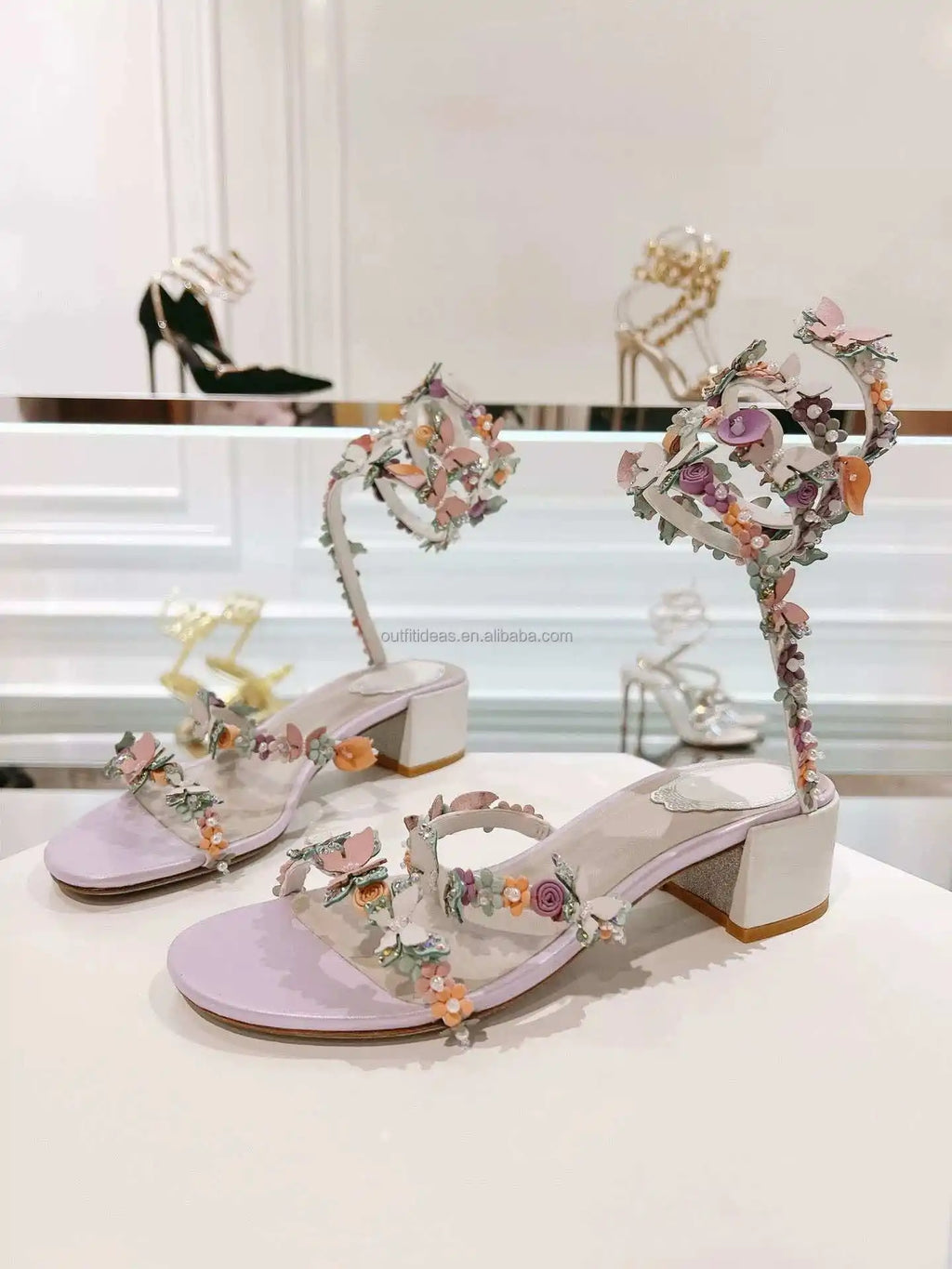 Lavender block-heel sandals with floral, butterfly, and pearl embellishments, perfect for luxury bridal or evening wear.