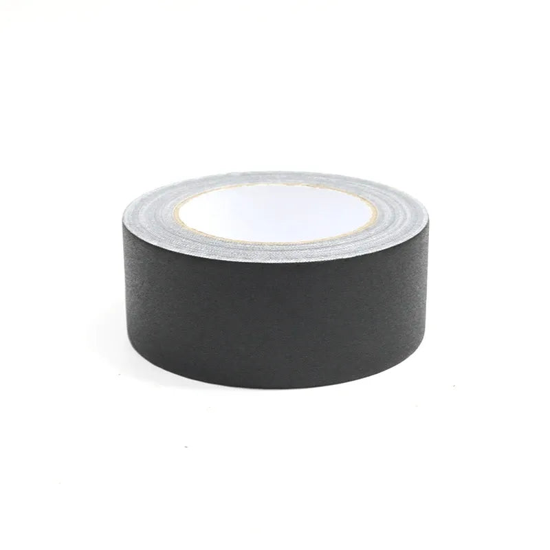 Single roll of black matte gaffer tape with light gray adhesive strip edge