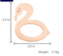 Light pink natural wood swan baby teething ring toy for relief.