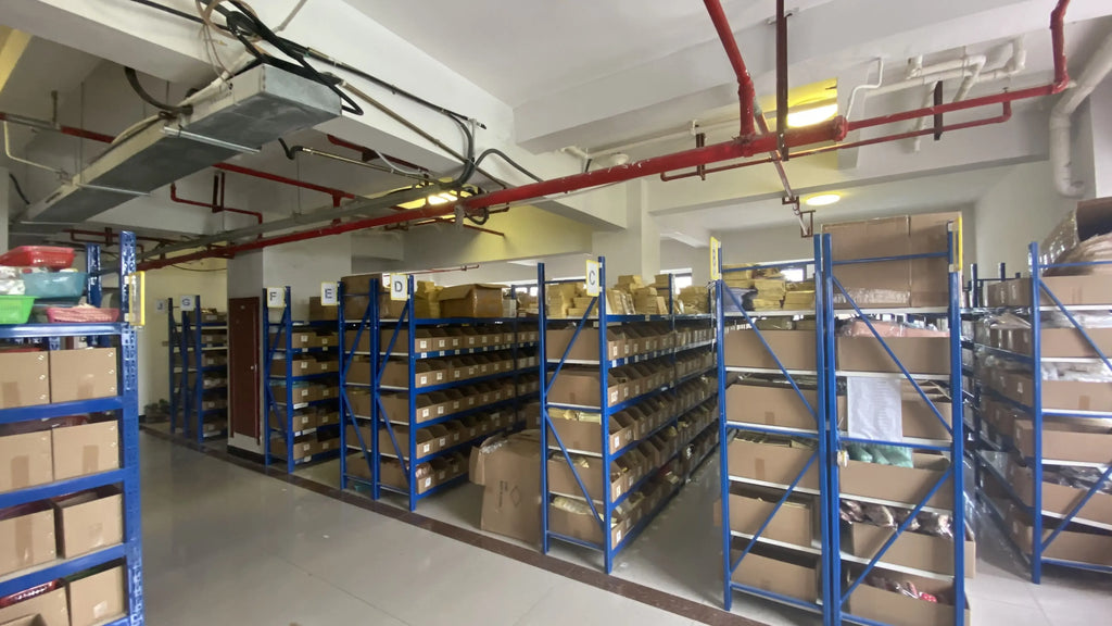 Warehouse shelving racks with stacked boxes and packaged supplies