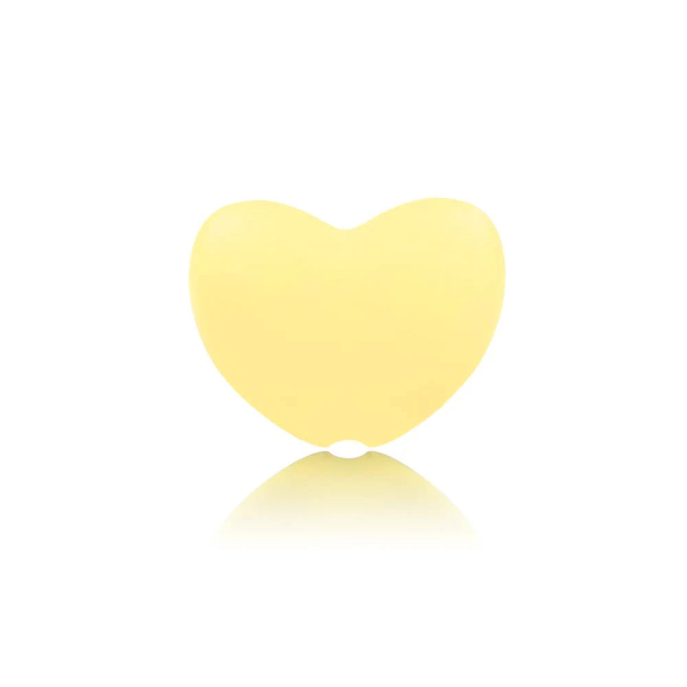 Yellow heart-shaped silicone baby teething toy for soothing gum pain.