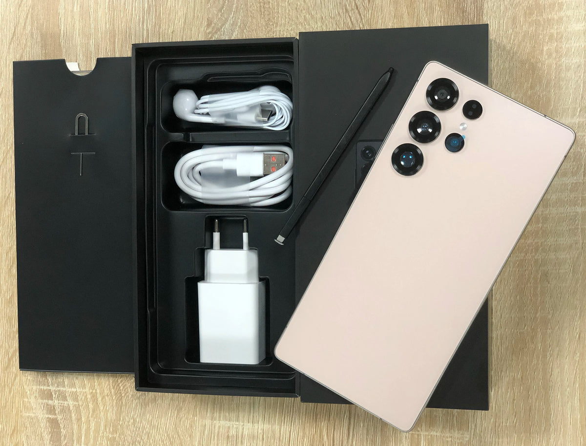 White smartphone with open retail box, charging cable, and wall adapter
