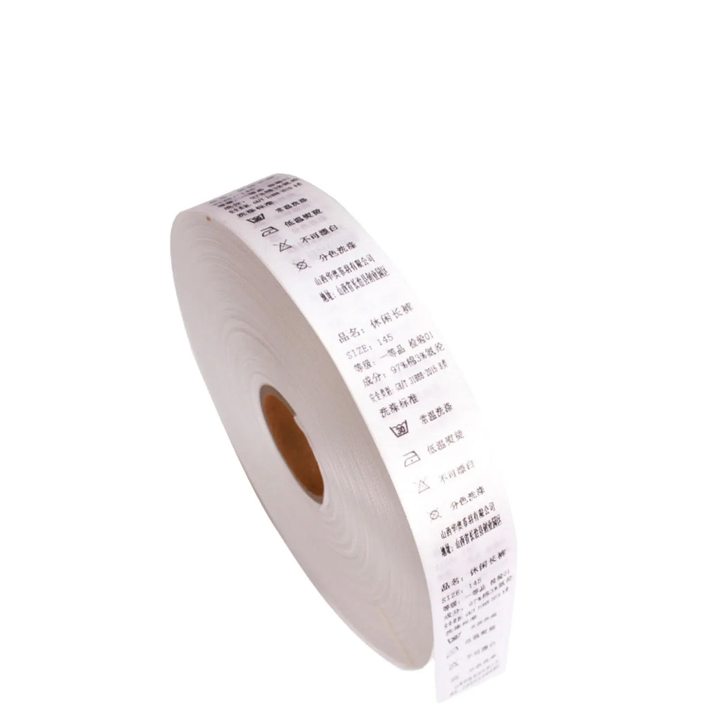 Thermal transfer label ribbon roll with small printed text on white strip