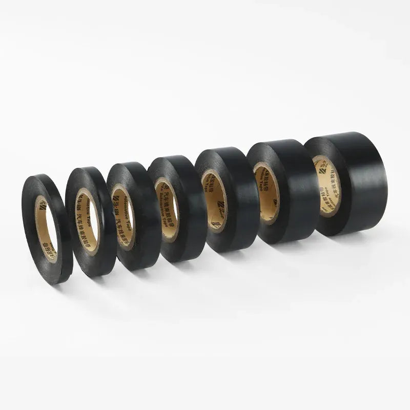 Black electrical insulation tape roll set with exposed tan adhesive liner
