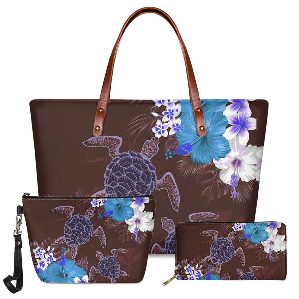 3-piece brown handbag set with Polynesian turtle and blue floral print, featuring leather handles and trunk style.