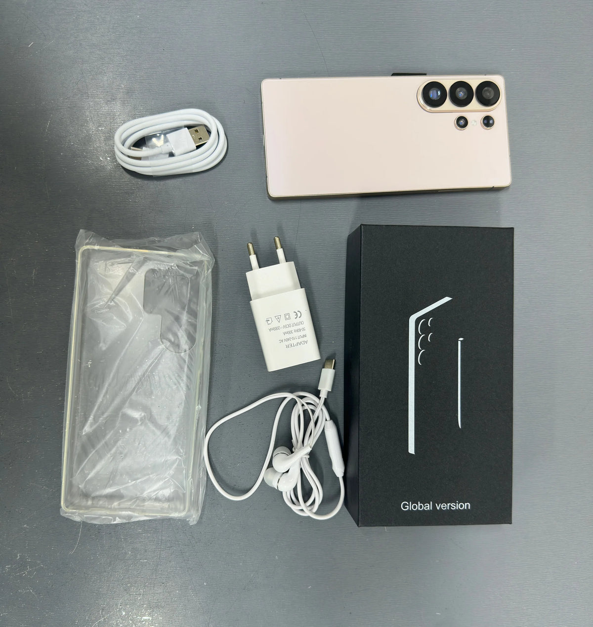 White unlocked smartphone kit with cable, charger, and Global version box