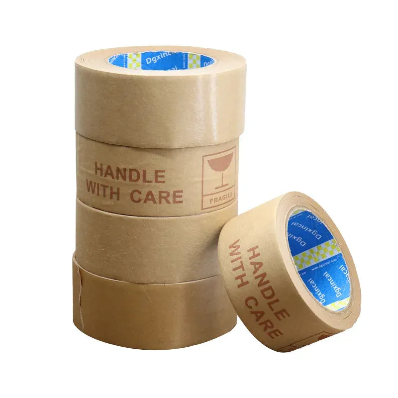 Brown kraft packing tape roll set with “HANDLE WITH CARE” printed on the outer wrap
