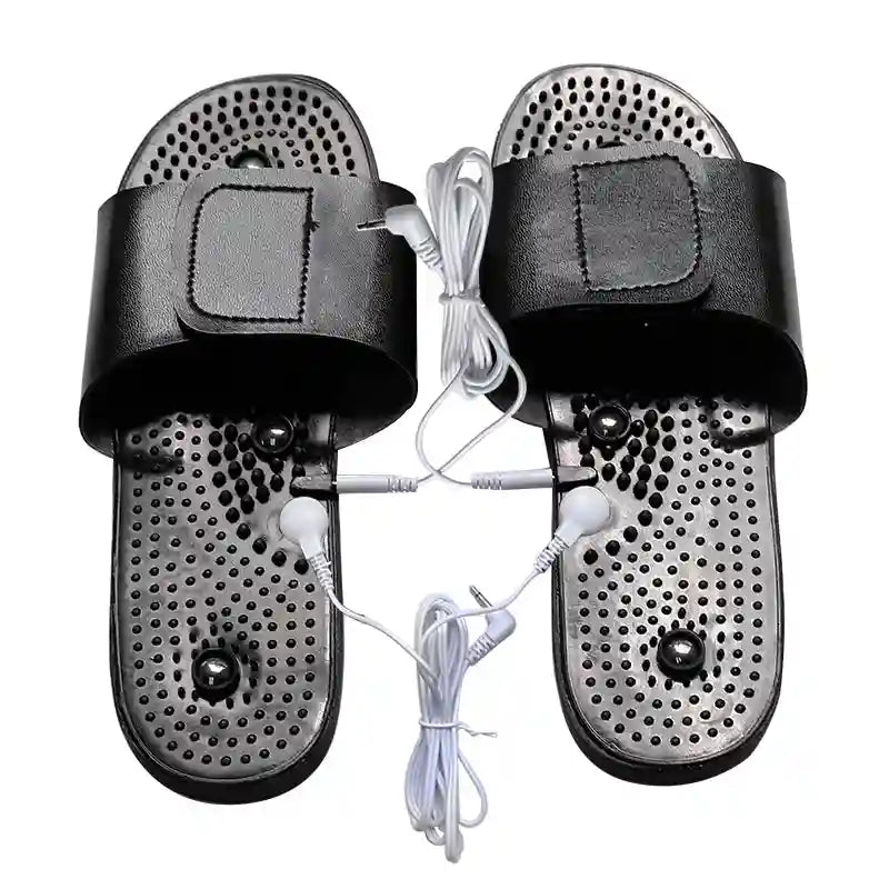 Black acupuncture massage slippers with reflexology nodes and wired TENS therapy electrodes for stress and foot pain.