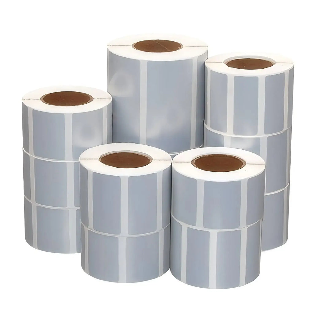 Rolls of matte silver thermal labels with blank label faces