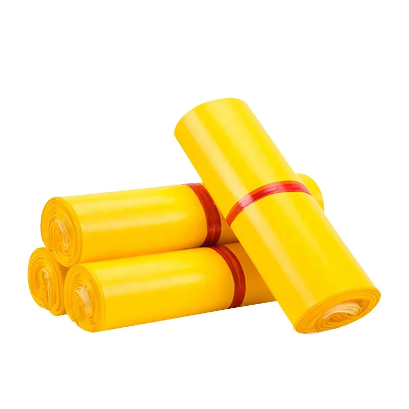Yellow poly mailer rolls secured with red bands