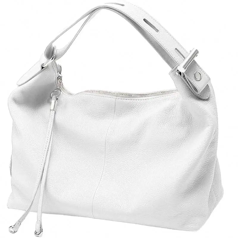 Luxury white leather hobo handbag with a singular strap, silver zipper, and dangling tassel details. Designer style.