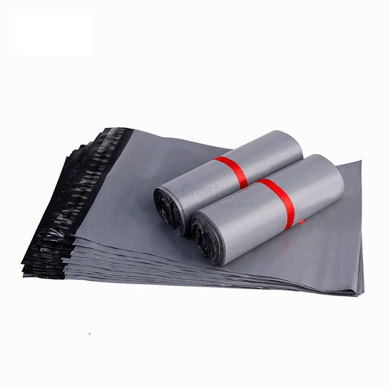 Gray poly mailer rolls with red sealing bands for packaging and mailing