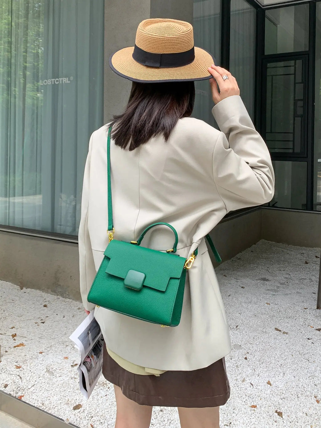Green genuine leather designer handbag, structured shoulder tote with top handle, gold hardware, elegant minimalist.