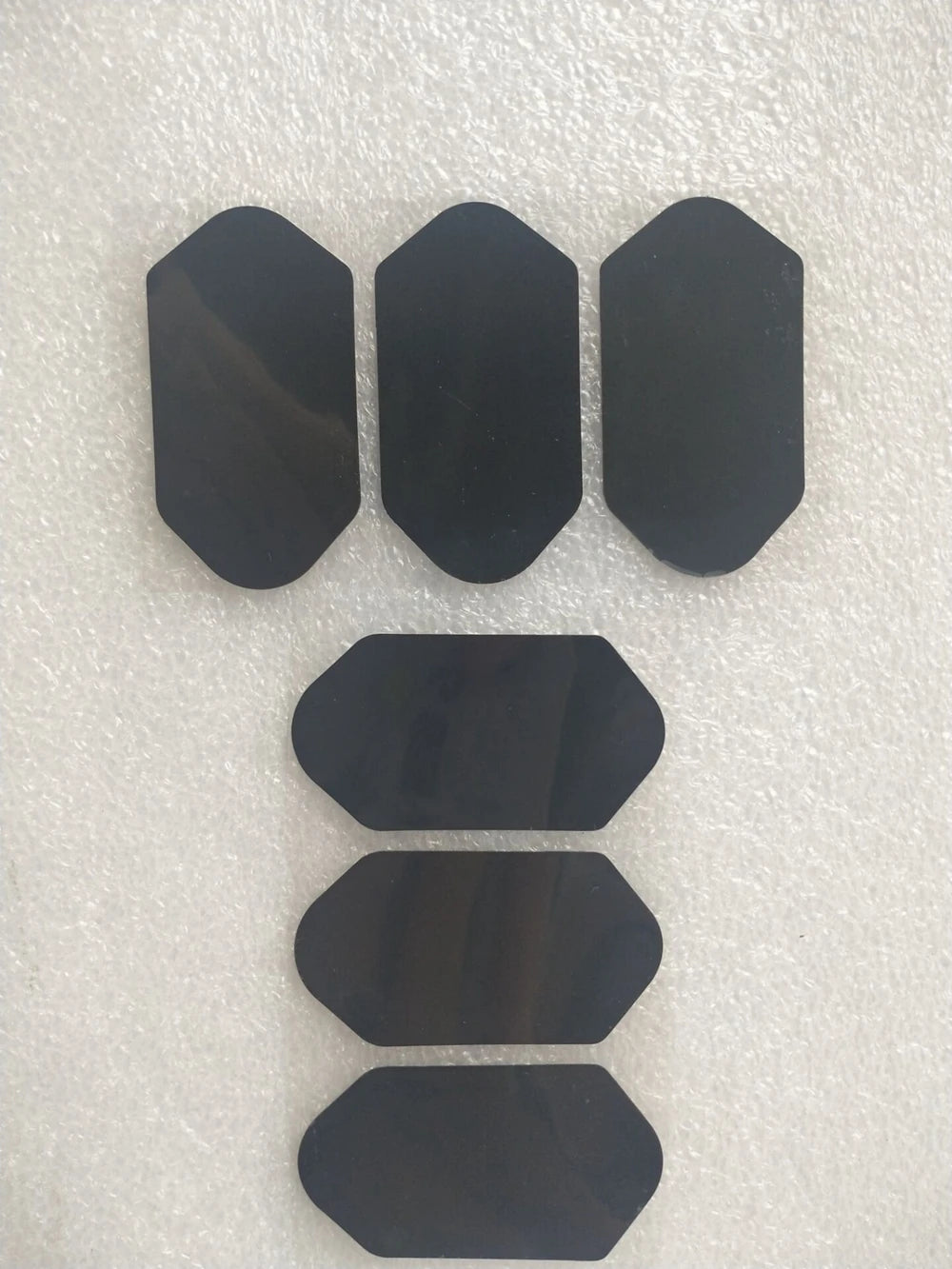 Six black adhesive film replacement stickers for 3D 4D HIFU beauty machine cartridges on a white background.