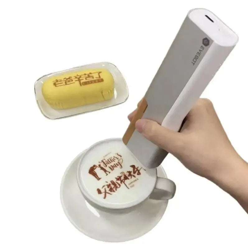 Handheld food ink printer pen printing an edible design on a drink cup lid