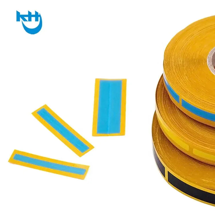 Yellow splice tape roll with blue stripes and cut tape pieces